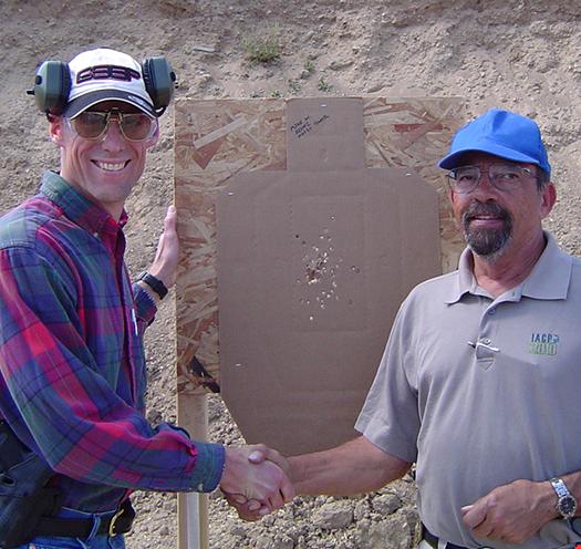 Above: Massad Ayoob (right) congratulates our guest columnist, Mike Wood, on a perfect qualification target.